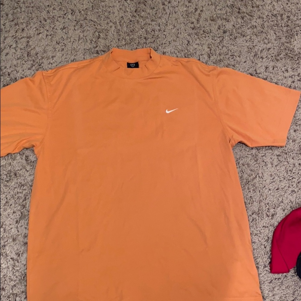 Men’s soft orange Nike dri-fit tee